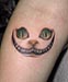 Tattoo Grinsekatze